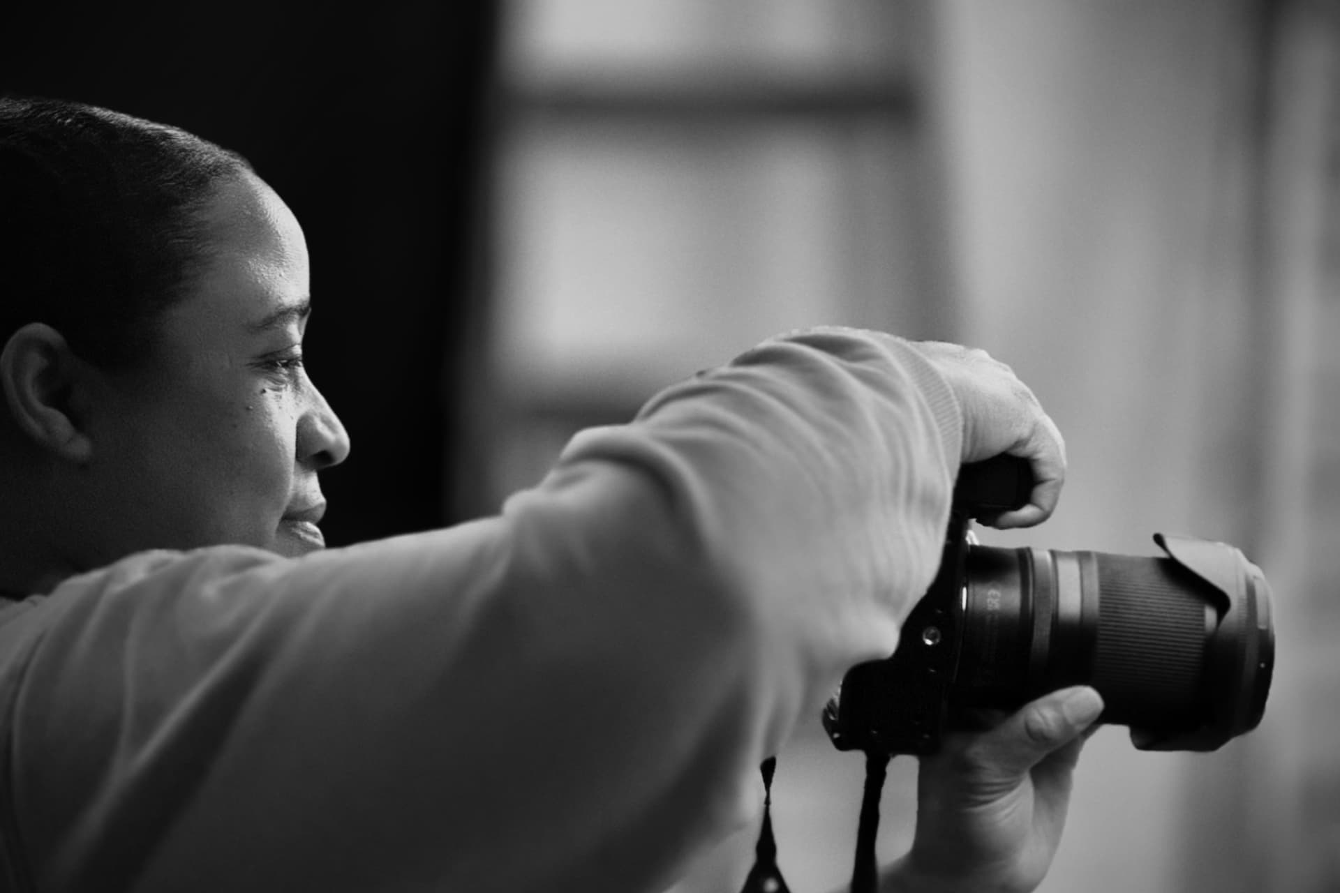 A close-up of a photographer using a camera