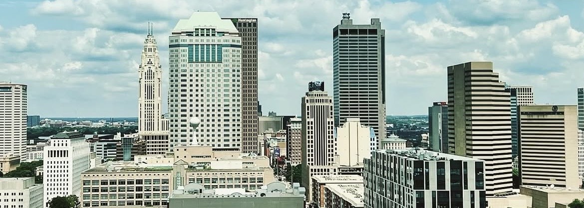 View of the downtown Columbus, Ohio skyline under a cloudy sky